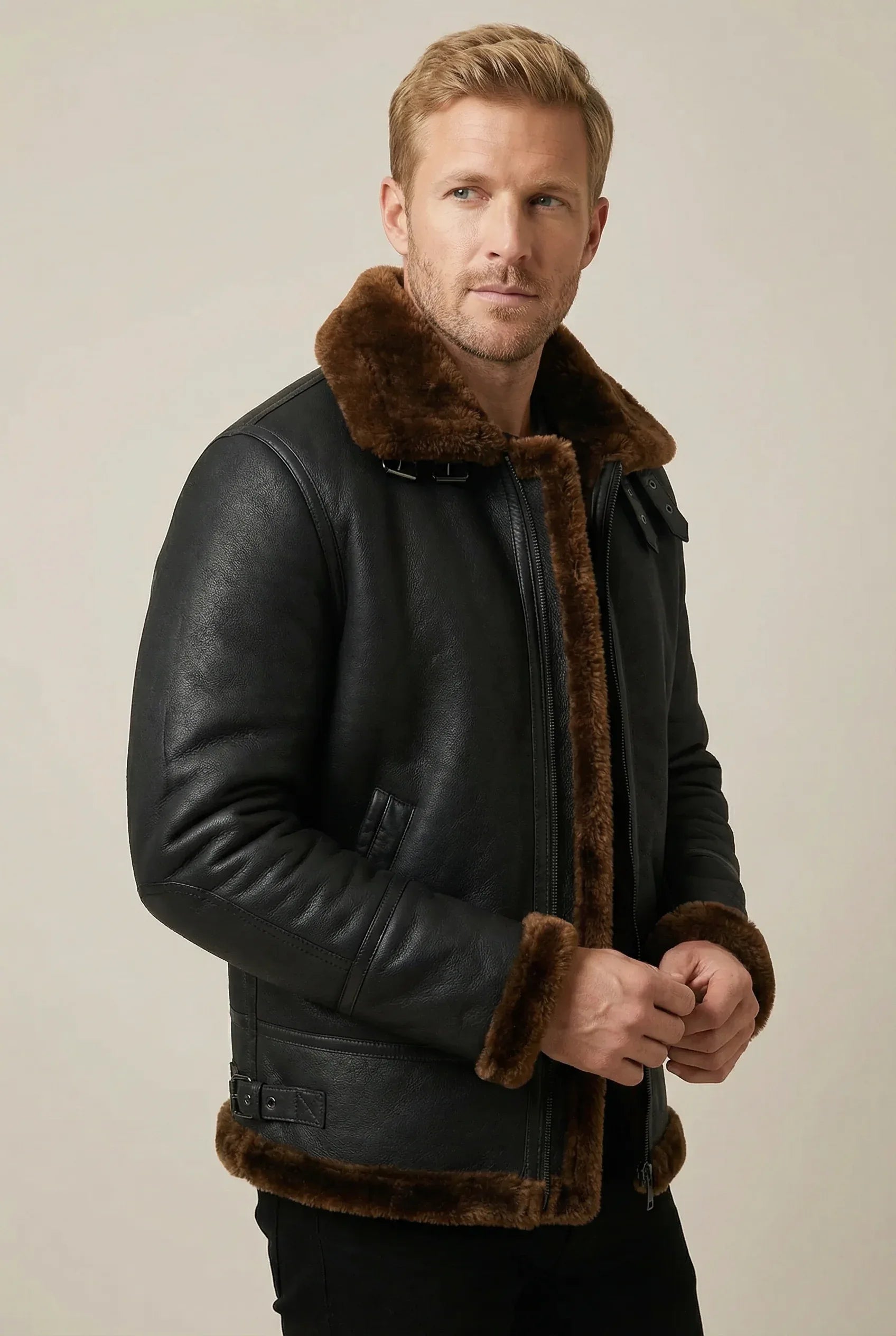 Black Ginger Shearlord B-3 Bomber Jacket made of sheepskin shearling, displayed against a soft neutral studio background.