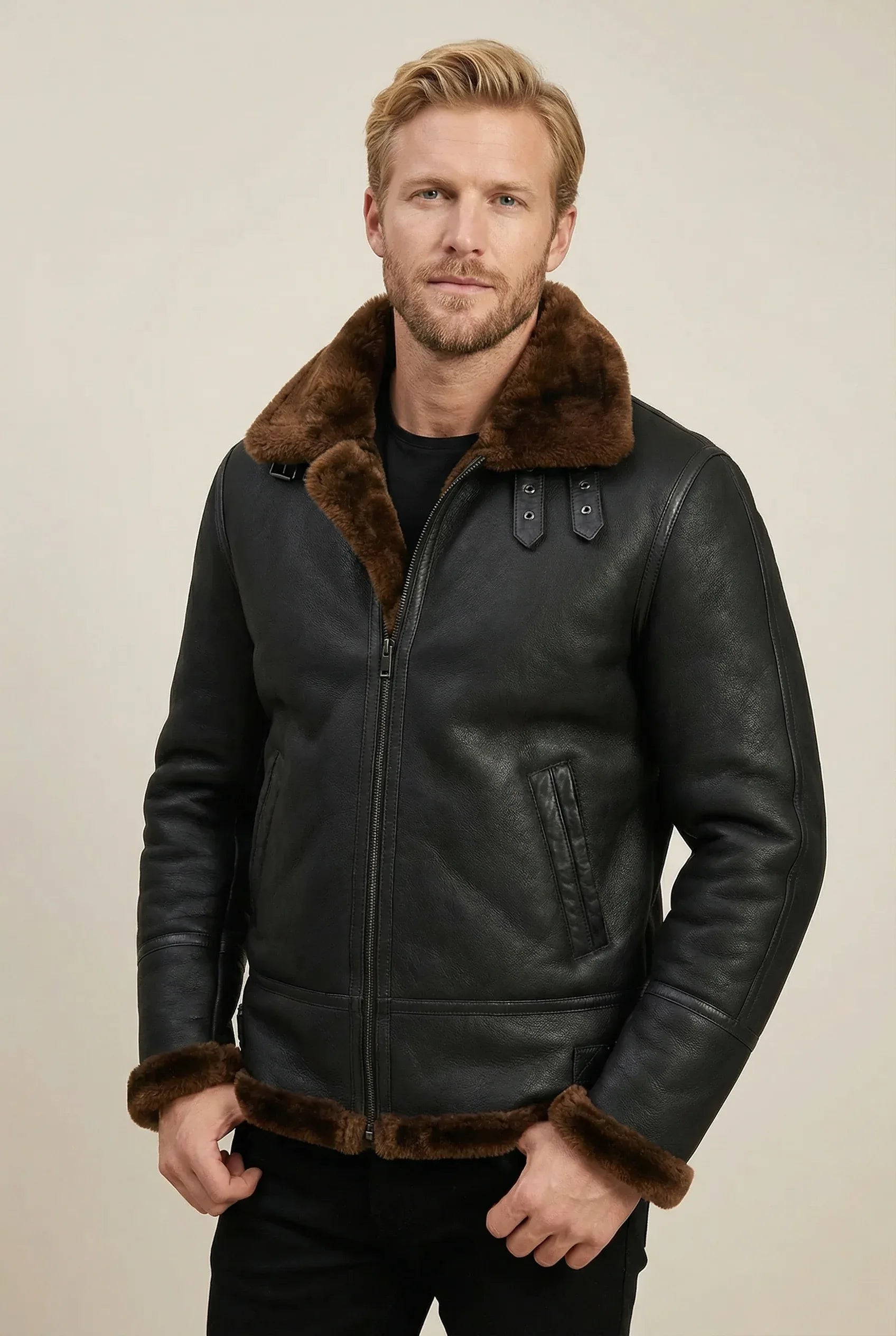 Black Shearlord B-3 Bomber Jacket made of sheepskin shearling, displayed against a soft neutral studio background.