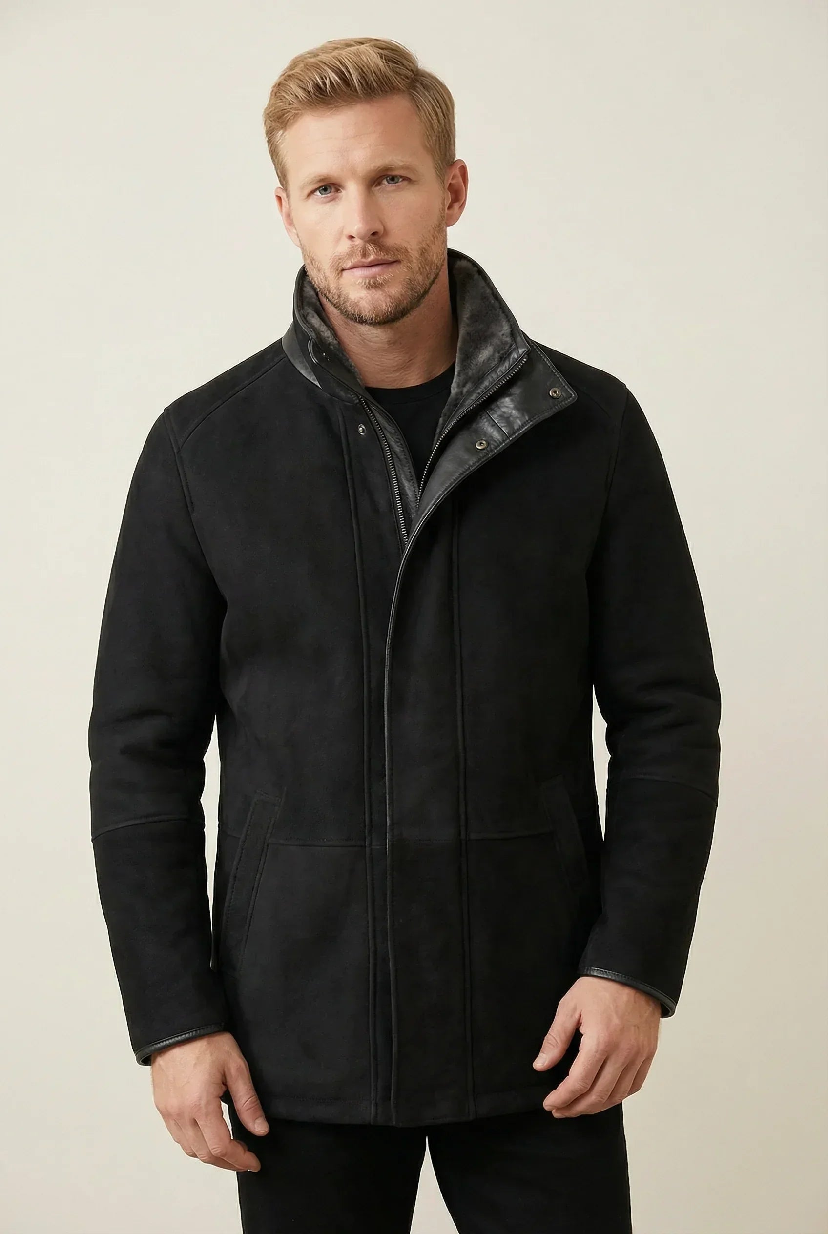 Black Shearlord Lucas Sheepskin shearling coat displayed against a soft, neutral studio background.
