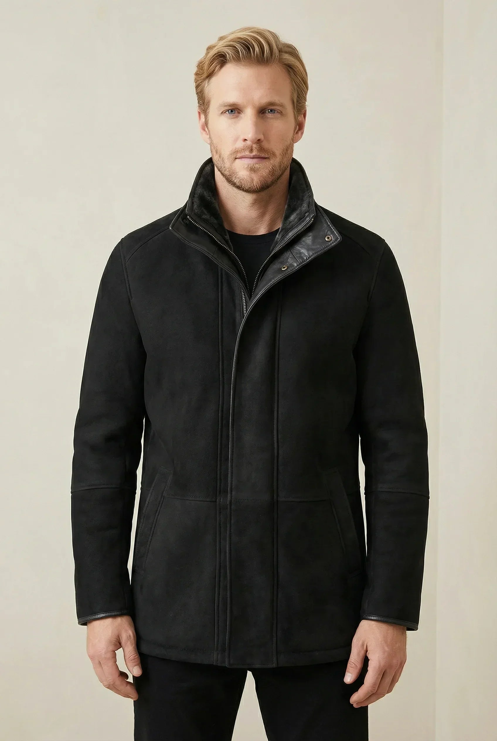 Black Shearlord Lucas shearling coat displayed on a neutral background, showcasing its soft texture and elegant design.
