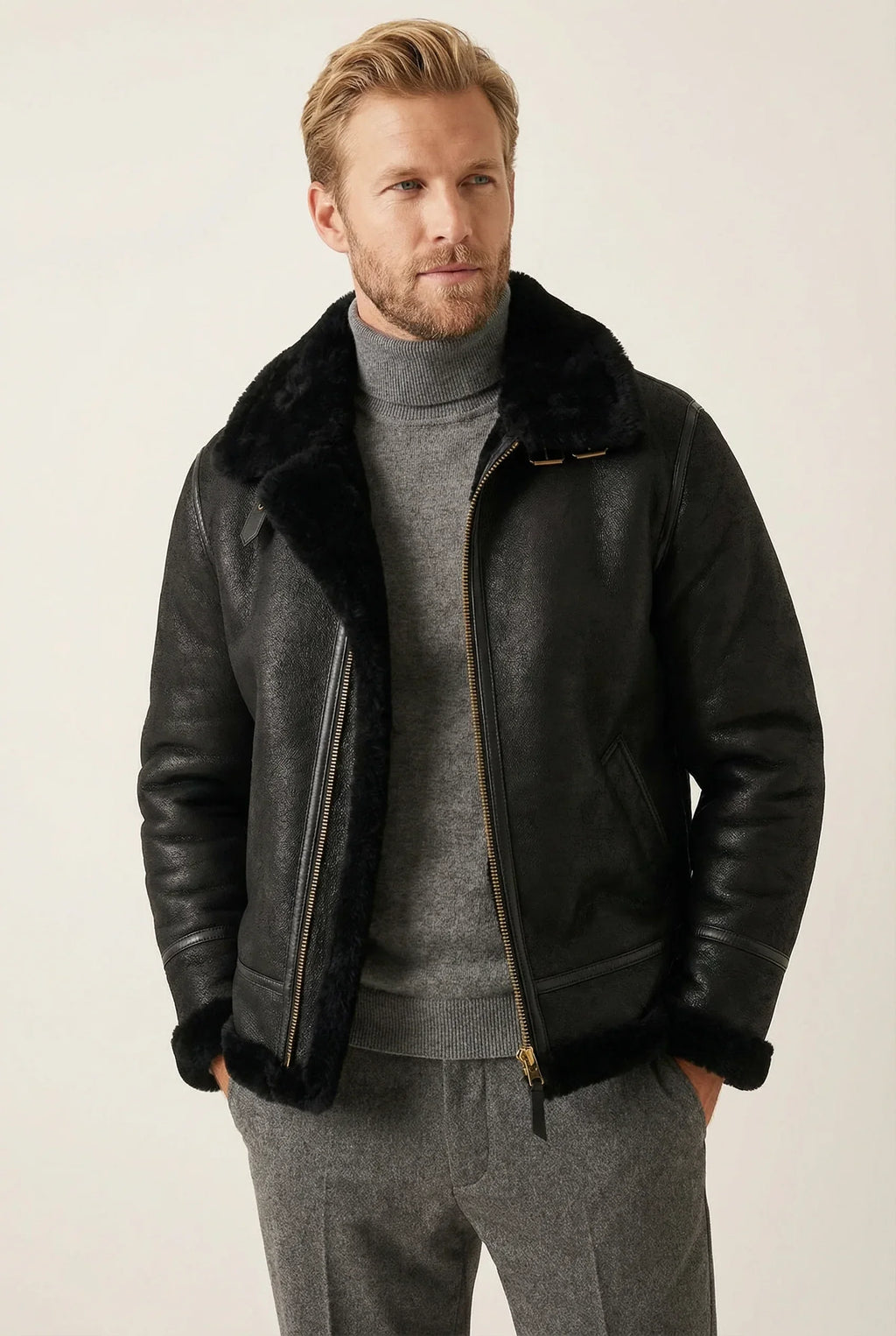 Classic black Shearlord B-3 bomber jacket in sheepskin, displayed against a soft neutral studio background.