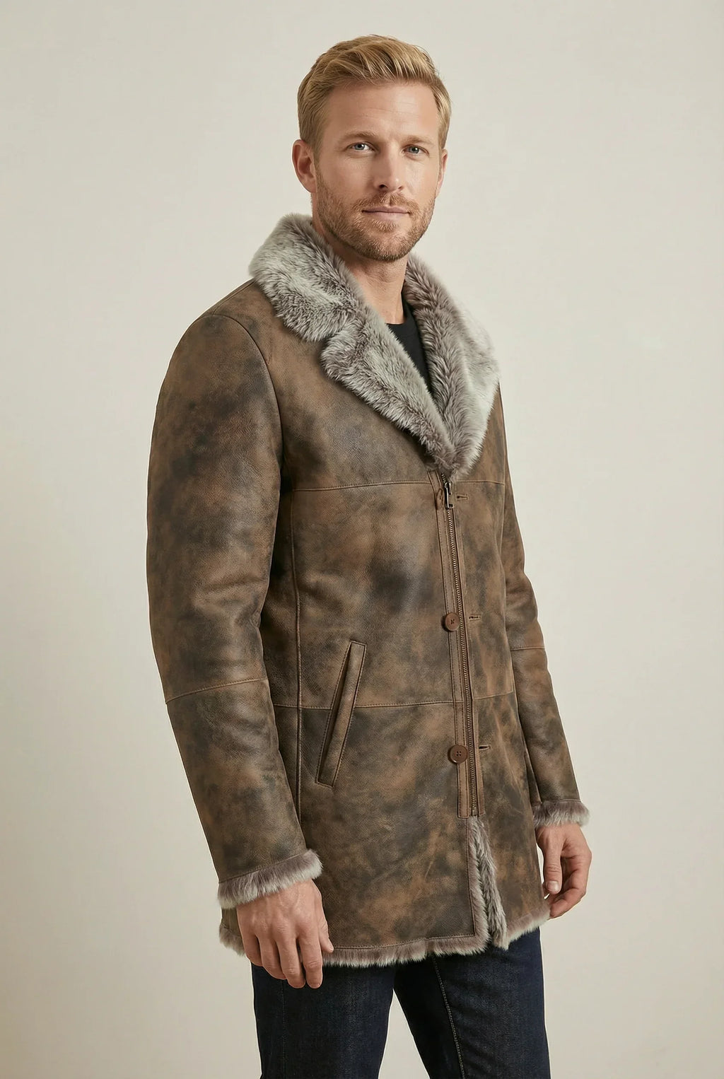 Shearlord Toscana sheepskin shearling coat displayed in a soft neutral studio with warm, off-white lighting.