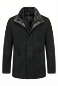 Black Shearlord Lucas shearling coat with slightly open zipper and collar label on a pure white background.